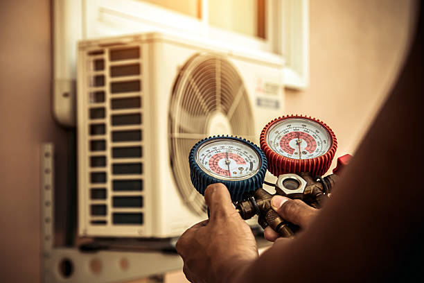 Professional Air Conditioning Service technician working in Sheldon, IL